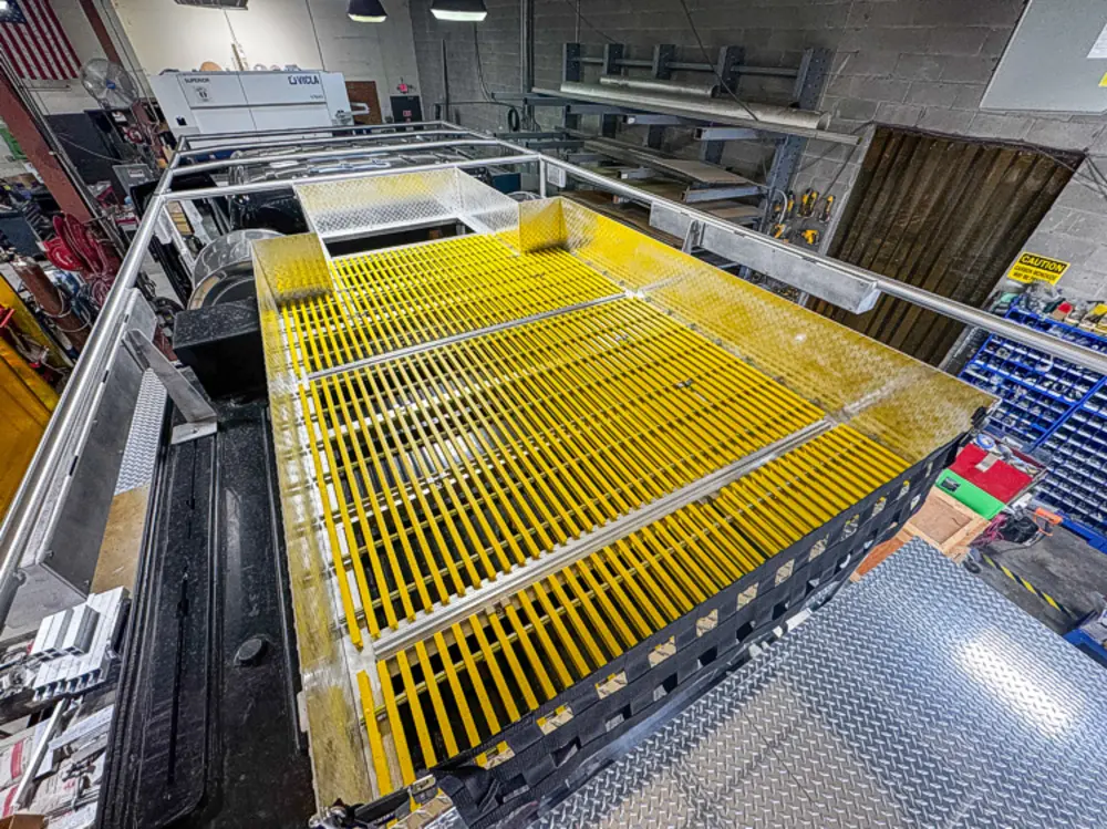 Diamond-plate body and step detail in production, photo 28 of 303.